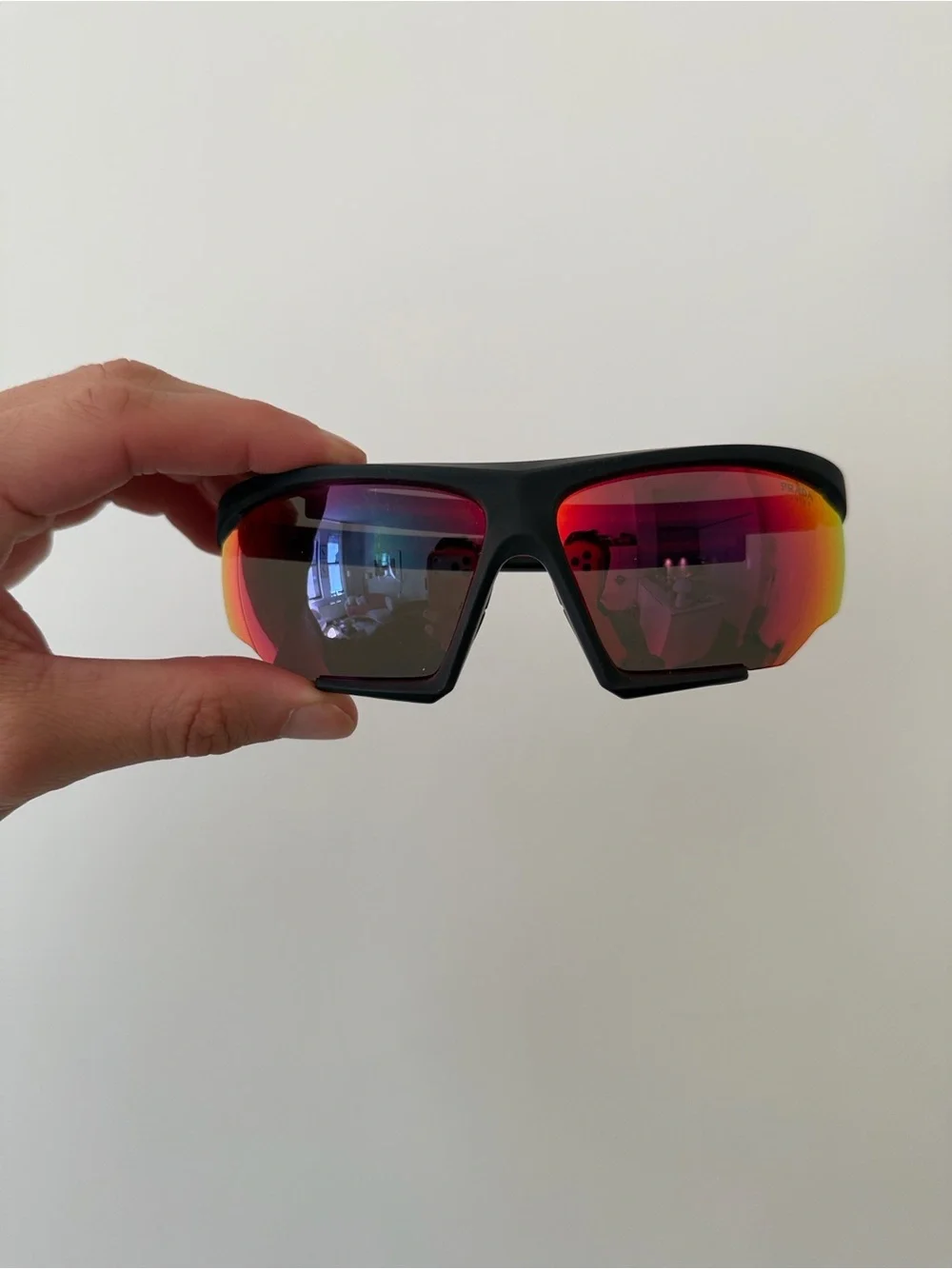 Prada Sports Sunglasses with Red Mirrored Lenses